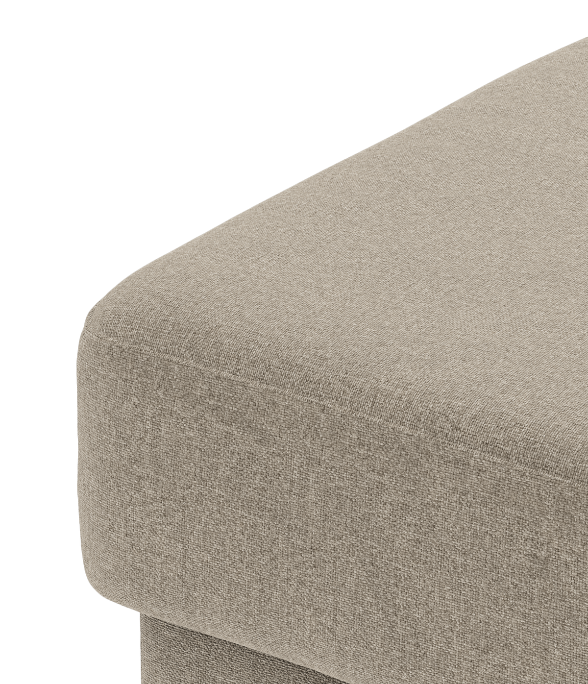Närbild av beige tygklädd hörn av soffa eller ottoman i studio.
