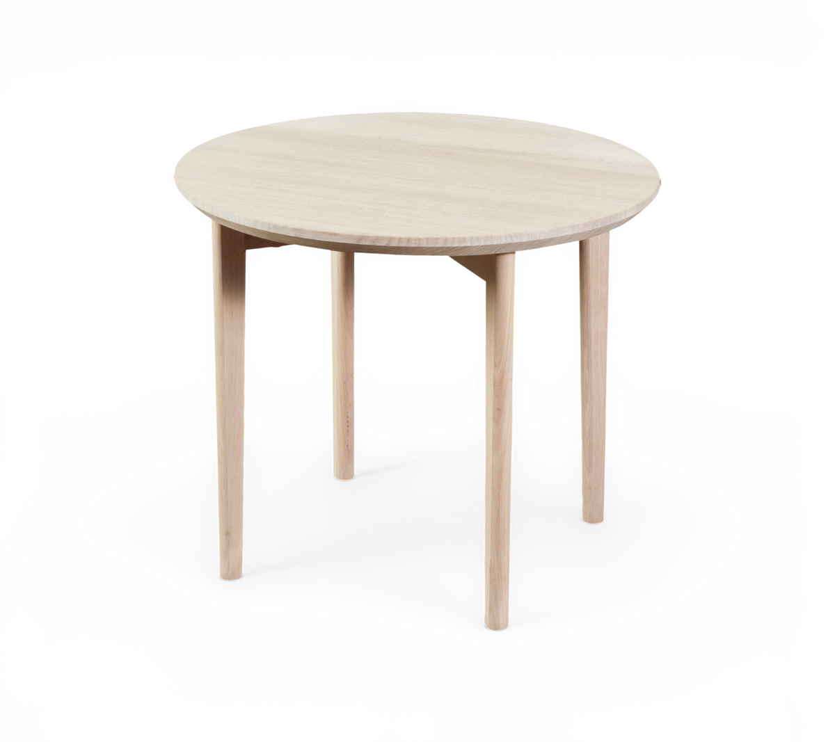 Runt bord i ljust trä med fyra ben och minimalistisk design.