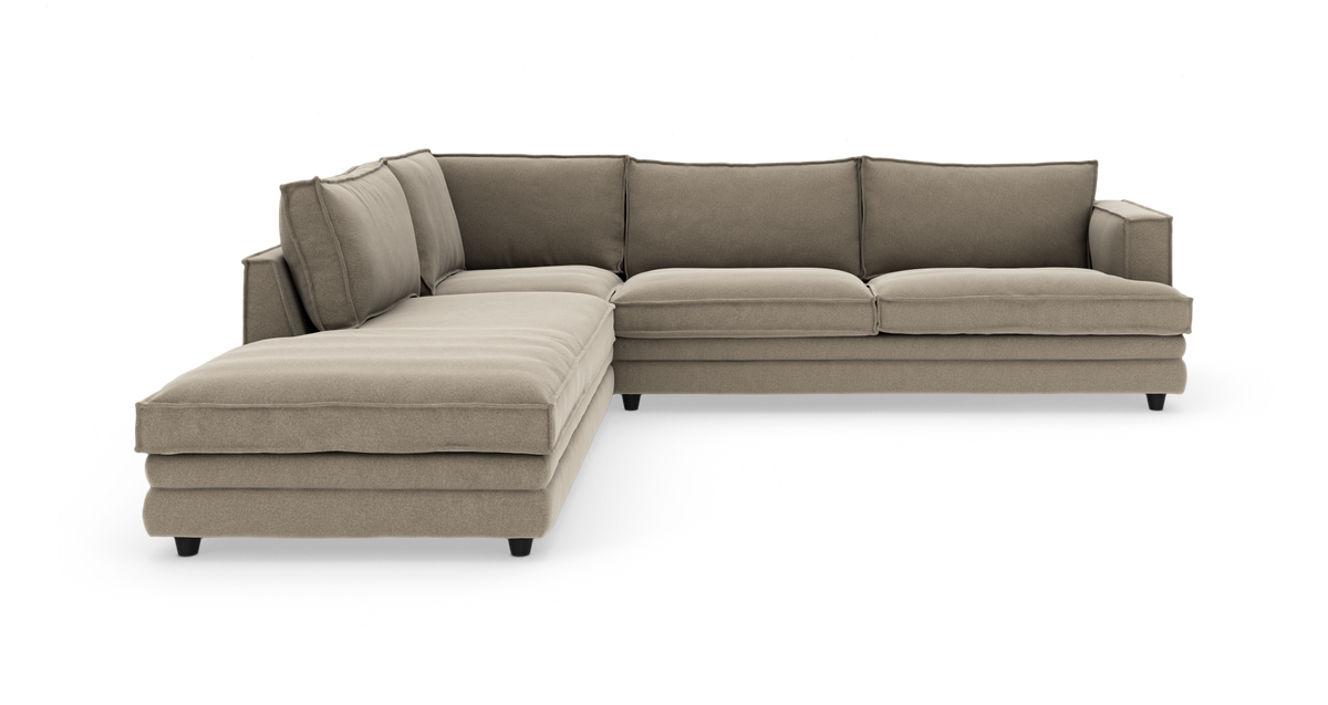Beige L-formad modulsoffa med schäslong, frilagd på vit bakgrund.