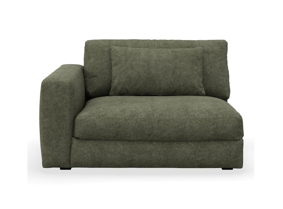 Grön modulsoffa med vänster armstöd och kudde, frontal vy mot vit bakgrund.