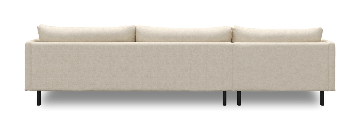 Beige soffa sedd bakifrån med svarta ben.