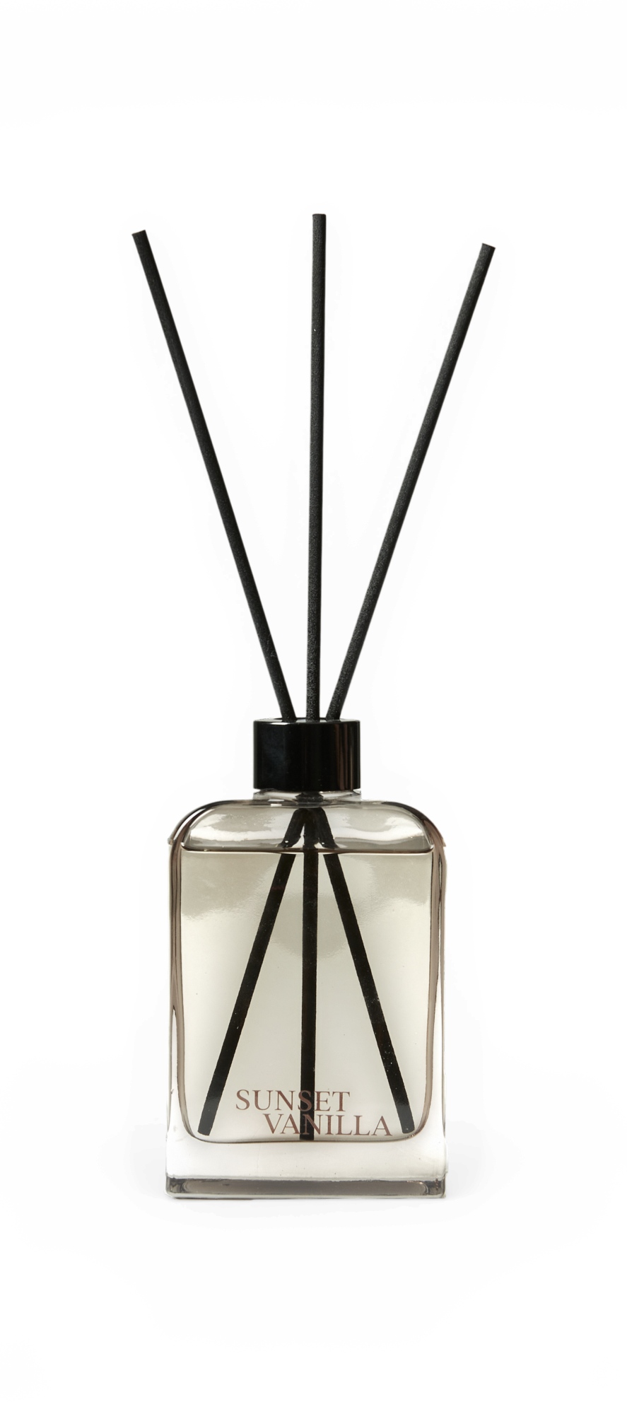 Doftspridare med pinnar i glasflaska, texten SUNSET VANILLA, på svart bakgrund.
