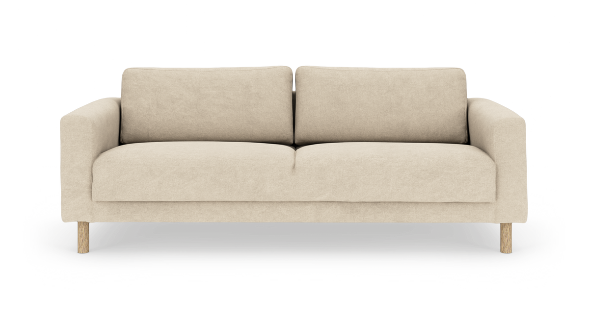 Beige tygsoffa med träben, sedd framifrån.