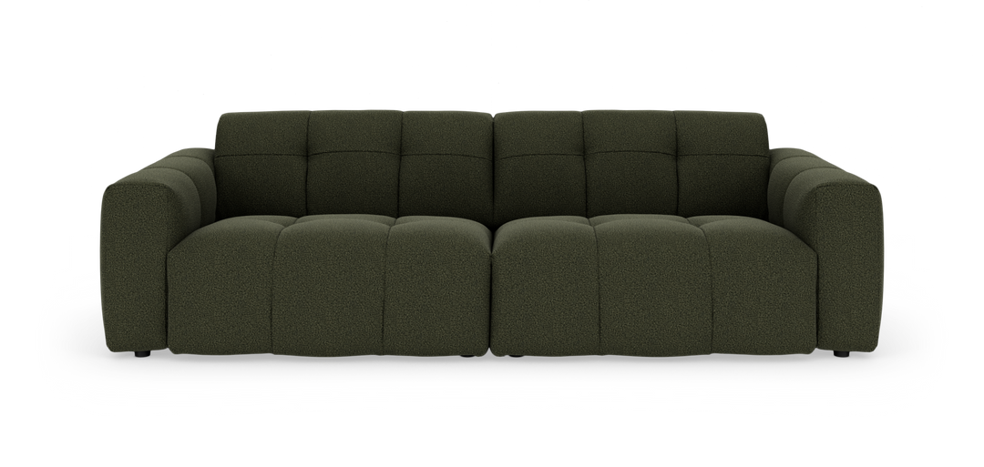 Mörkgrön modulsoffa med mjuka, generösa sektioner och rundade armlän, frontvy mot vit bakgrund.
