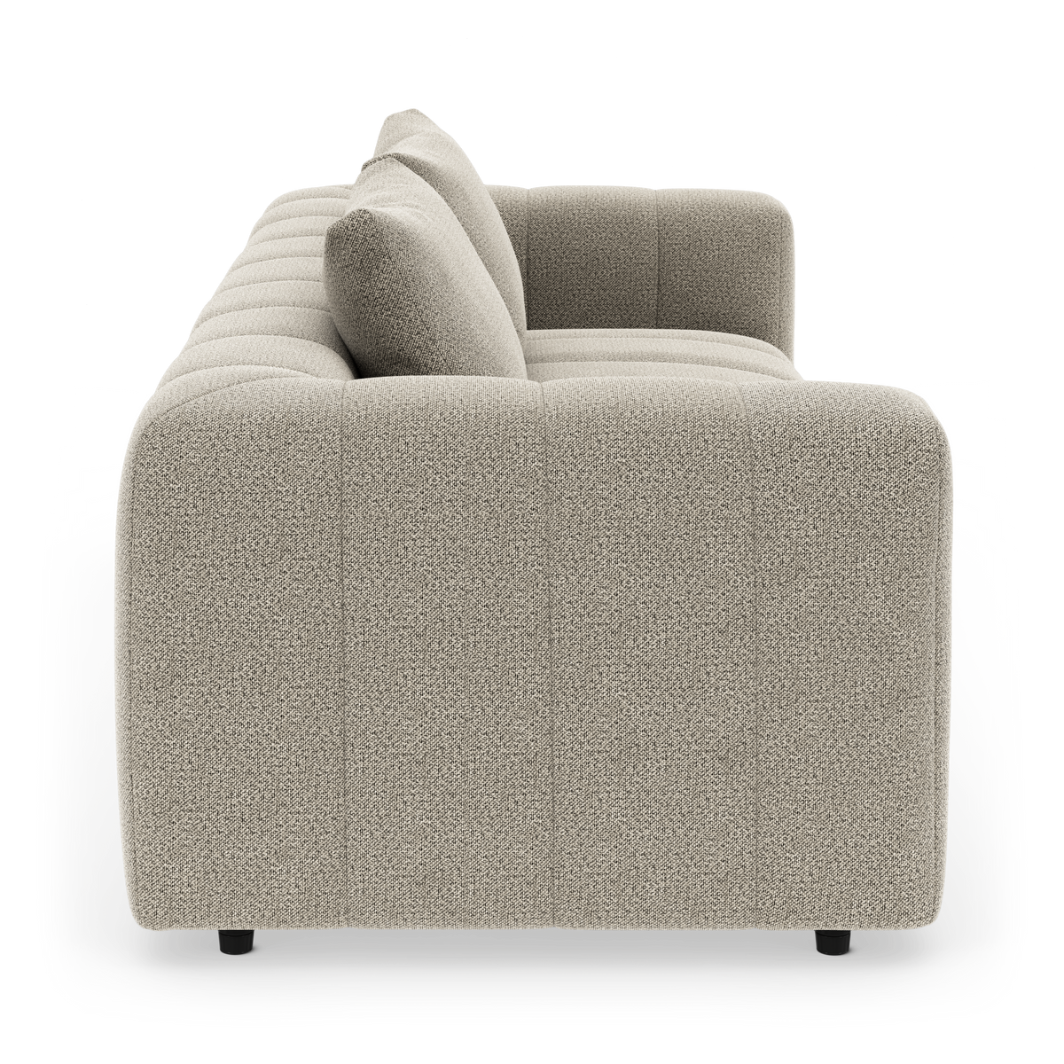 Beige modulsoffa sedd från sidan med rundade former och två ryggkuddar på vit bakgrund.