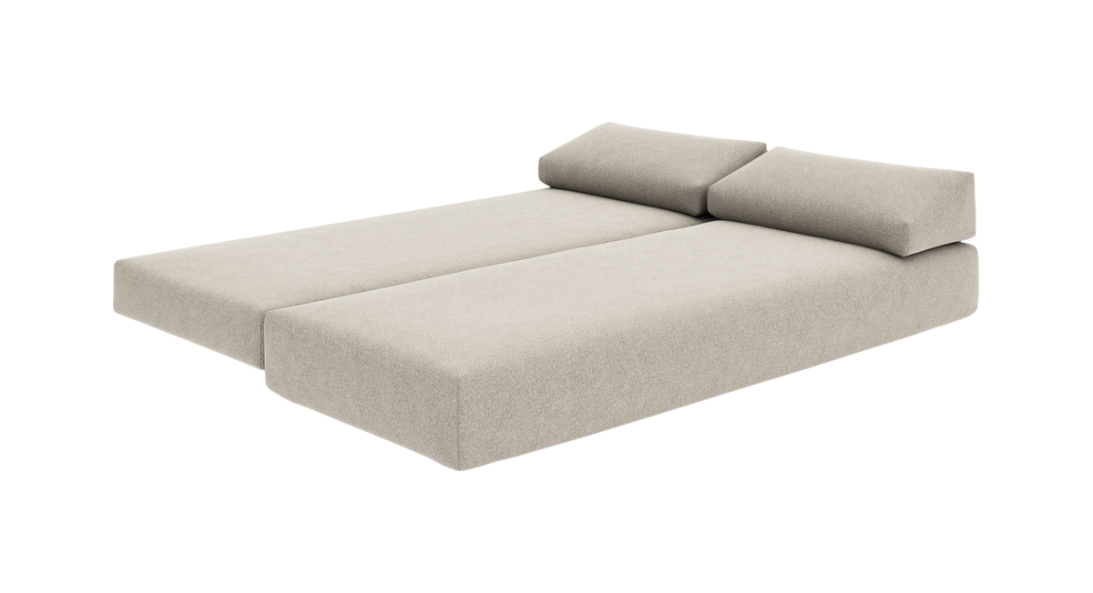 Beige modulsoffa/soffbädd med två ryggkuddar i frontvinkel på vit bakgrund.