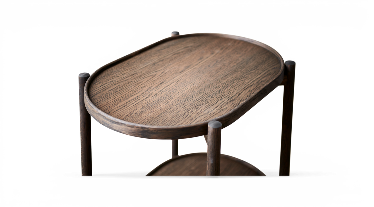 Oval sidobord i mörkt trä med upphöjd kant, frilagd närbild.