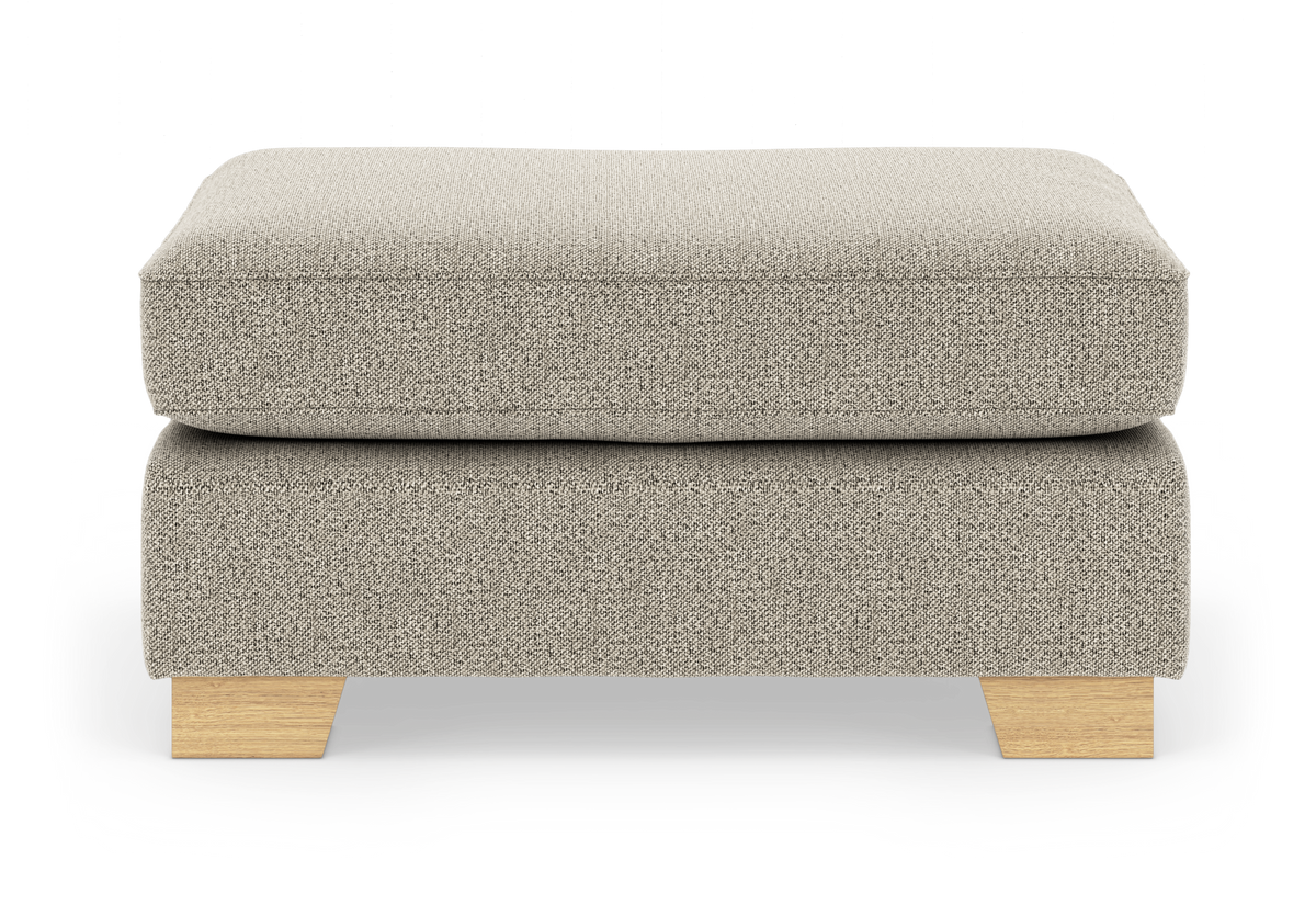 Beige fotpall/ottoman i textil med träben, frilagd produktbild framifrån.