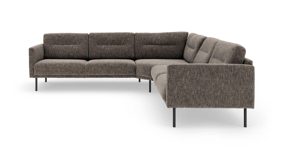 Modulär L-soffa i gråmelerad textil med smala metallben, fotad snett framifrån på vit friläggning.