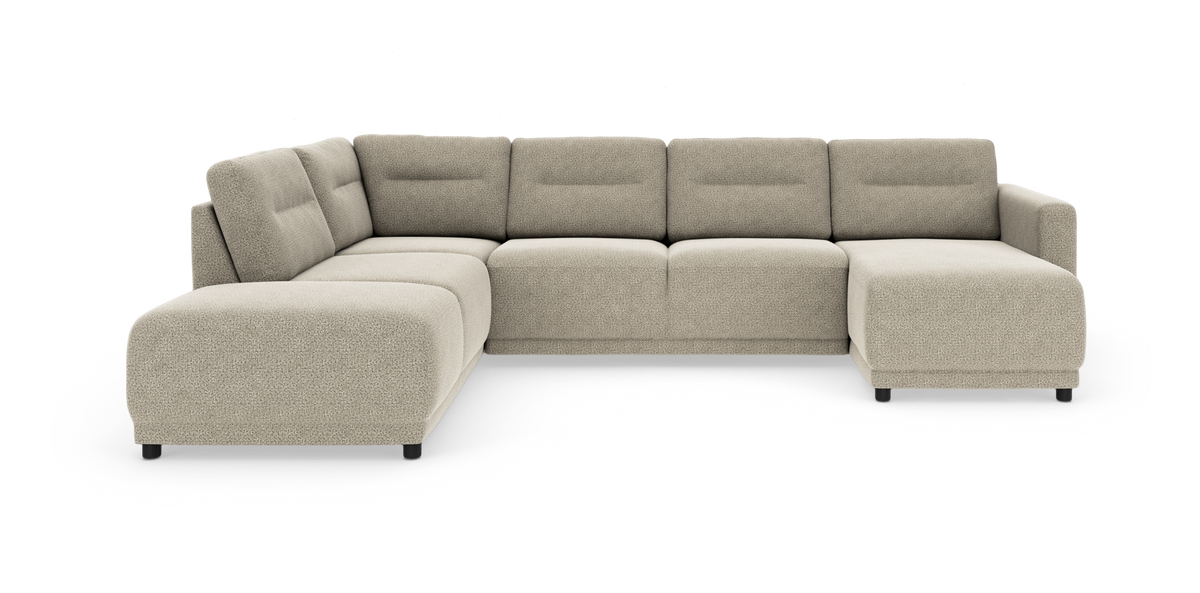 Beige modulsoffa i L‑form med breda, rundade sitsar och låg rygg, fristående på vit bakgrund.