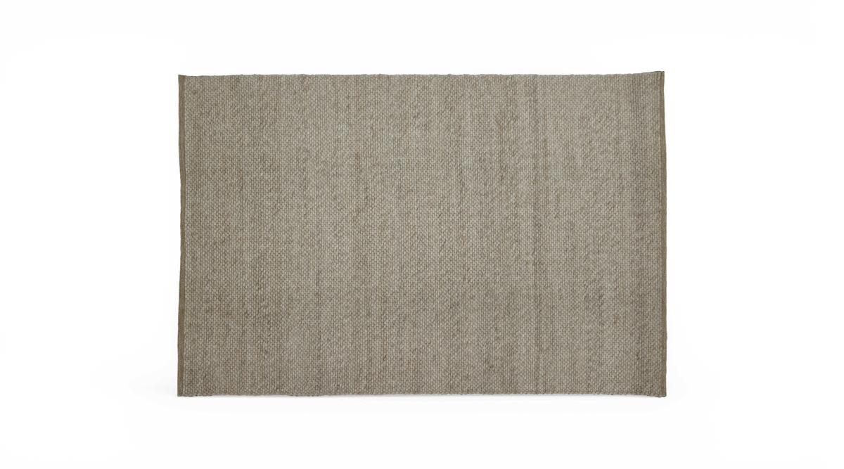 Beige vävd matta med subtil ton‑i‑ton‑struktur.