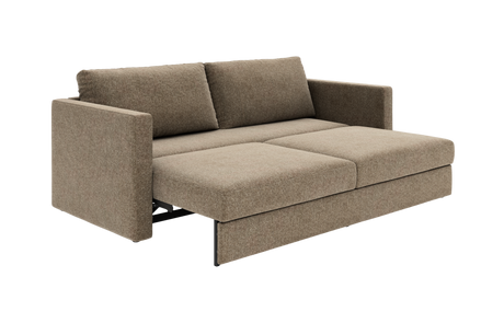 Beige bäddsoffa med två ryggkuddar, utdragen till sängläge.