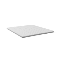 Vit bäddmadrass/topmadras med vågformad quiltning på vit bakgrund.