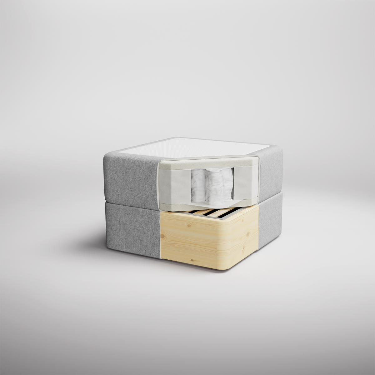 Isometrisk visning av en grå madrassmodul med snitt som visar pocketfjädrar och en underdel i ljust trä med lameller, mot vit studiobakgrund.