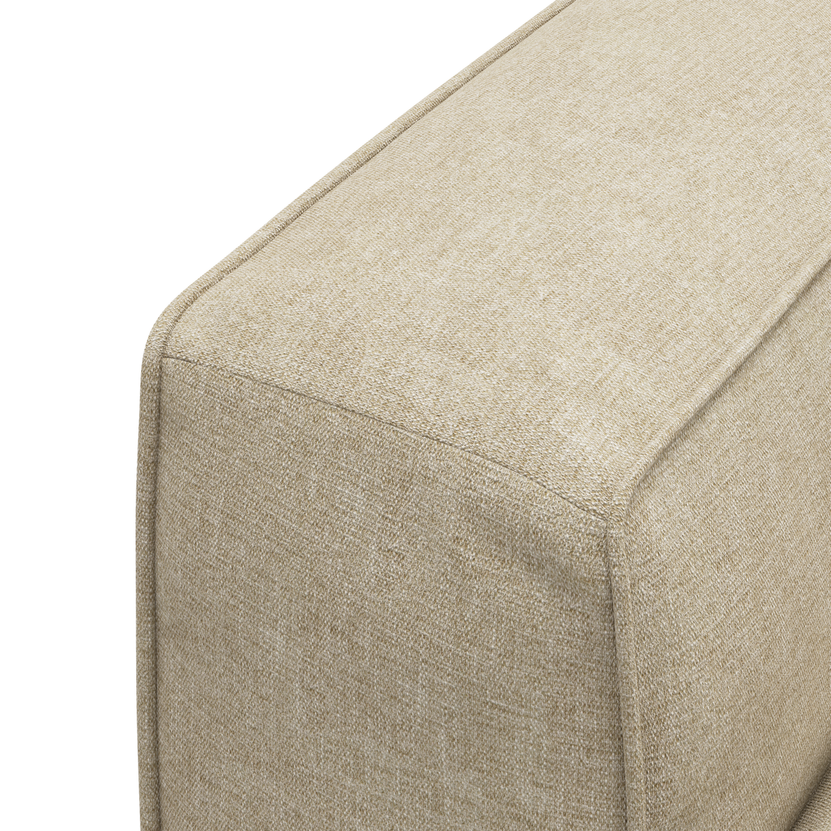 Närbild av beige textilklädd soffa/puff-modul med synliga sömmar.