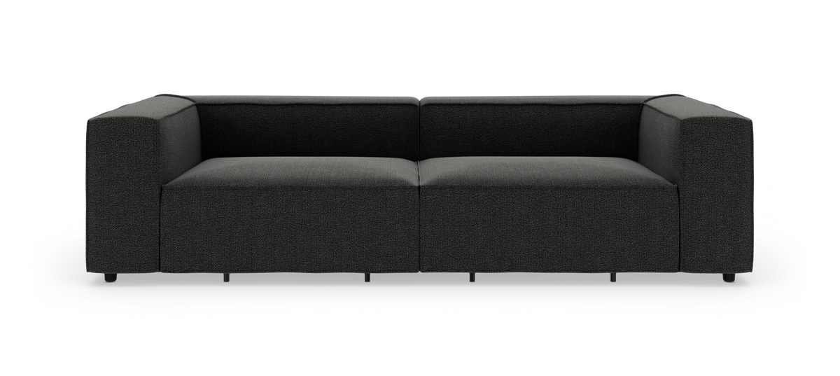 Svart, modern modulsoffa med tjocka armstöd, fotograferad rakt framifrån på vit bakgrund.