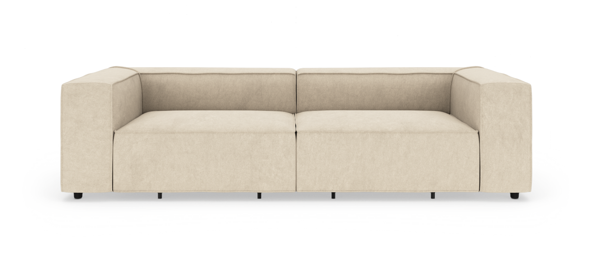 Beige modulsoffa med breda armstöd och två sittplatser, frilagd på vit bakgrund.