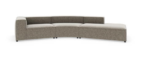 Modulsoffa i ljusgrå‑beige tyg med böjd sektion och chaiselongdel, fristående mot vit bakgrund.