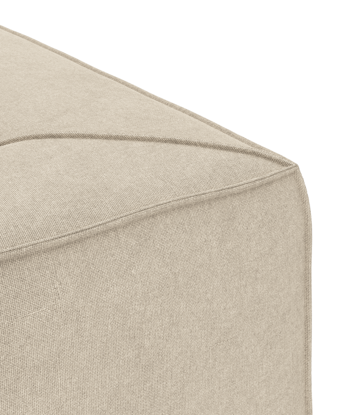 Närbild på hörn av beige, tygklädd puff med tydlig söm.