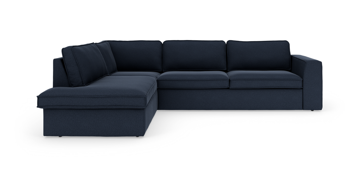 Mörkblå L‑soffa/hörnsoffa med schäslong till vänster i modern, enkel design.