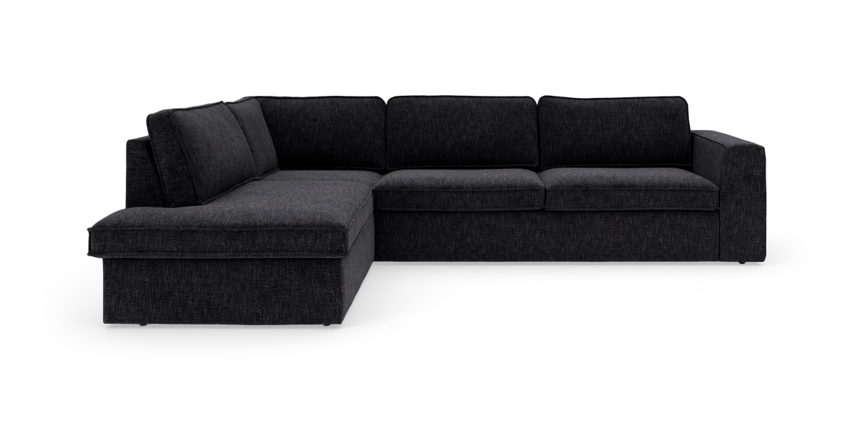 Mörkgrå L‑formad modulsoffa med divan till vänster, friställd mot vit bakgrund.