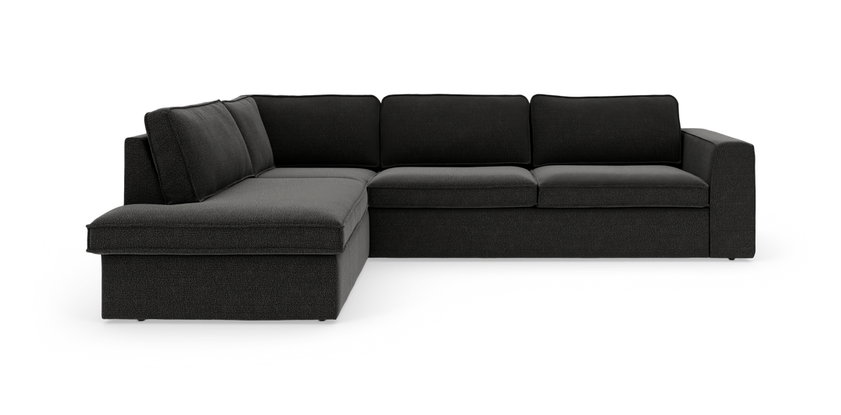 Mörkgrå L‑soffa med vänsterställd schäslong och breda armstöd, modern modulär hörnsoffa på vit bakgrund.