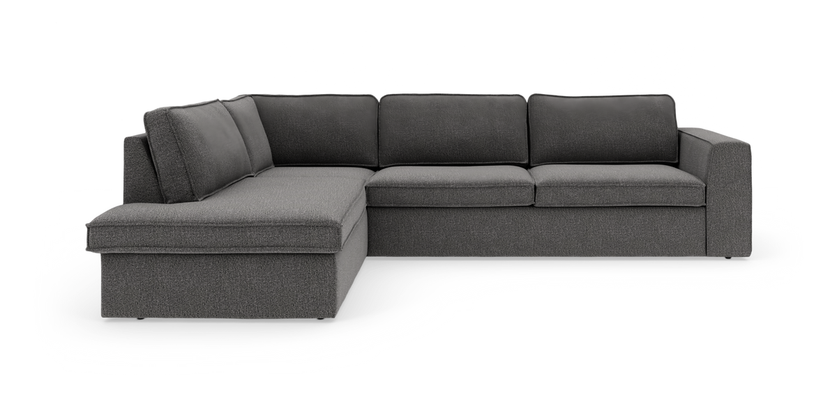 Mörkgrå L‑soffa med schäslong till vänster, 4‑sits tygsoffa i modern, rak design.