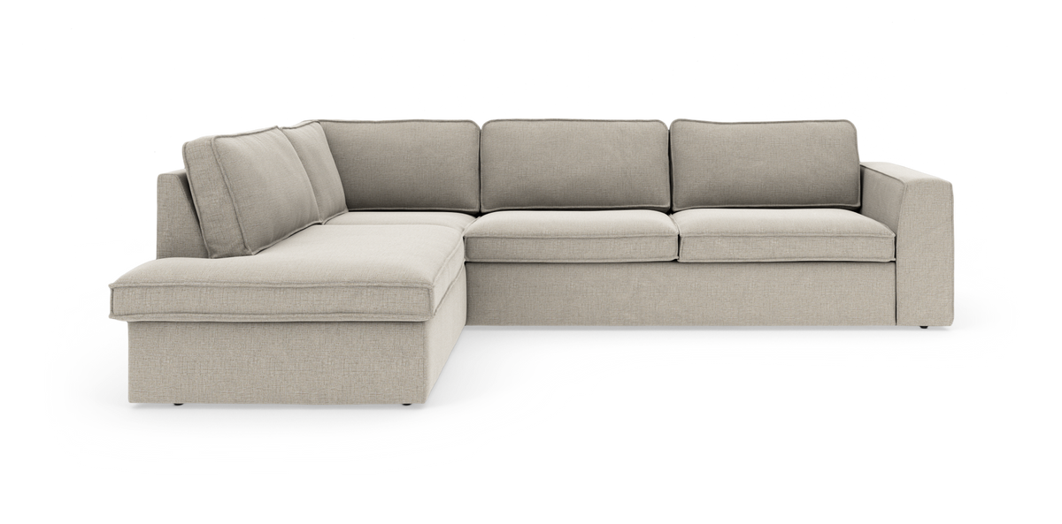 Beige L‑formad modulsoffa med vänster schäslong och breda armstöd, friställd på vit bakgrund.