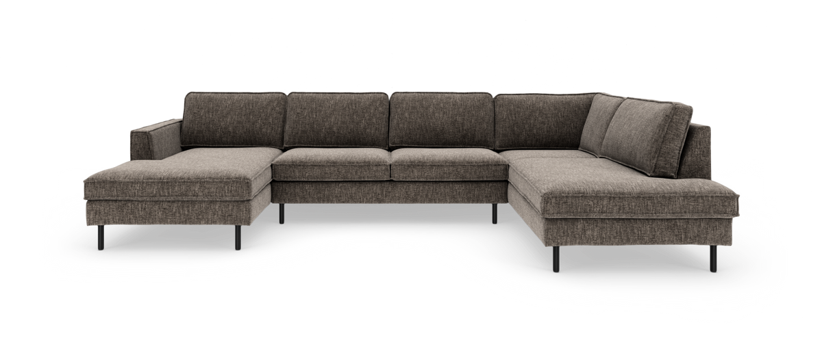 Stor U-formad modulsoffa i mörkgrå textil med smala svarta ben och chäslonger på båda sidor.