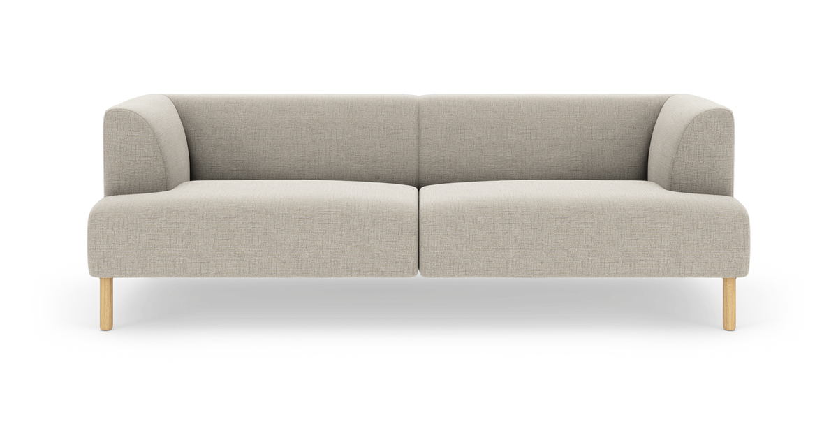Beige tvåsitsig modulsoffa med rundade hörn och ljusa träben, frilagd på vit bakgrund.