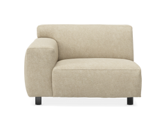 Beige modulsoffa, hörnsektion med vänster armstöd på svarta ben, frontvy.