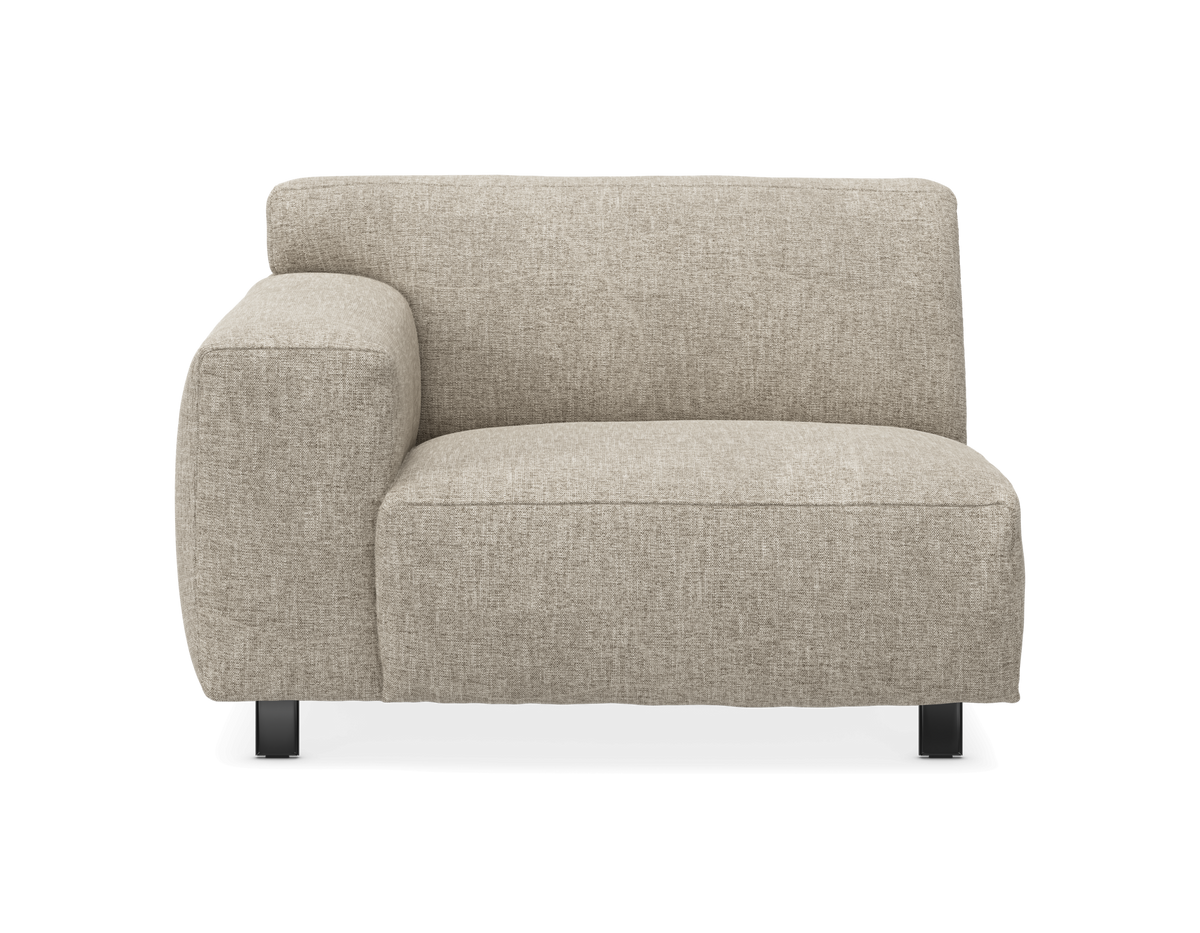 Beige modulsoffa med vänster armstöd, frontal vy mot vit bakgrund.