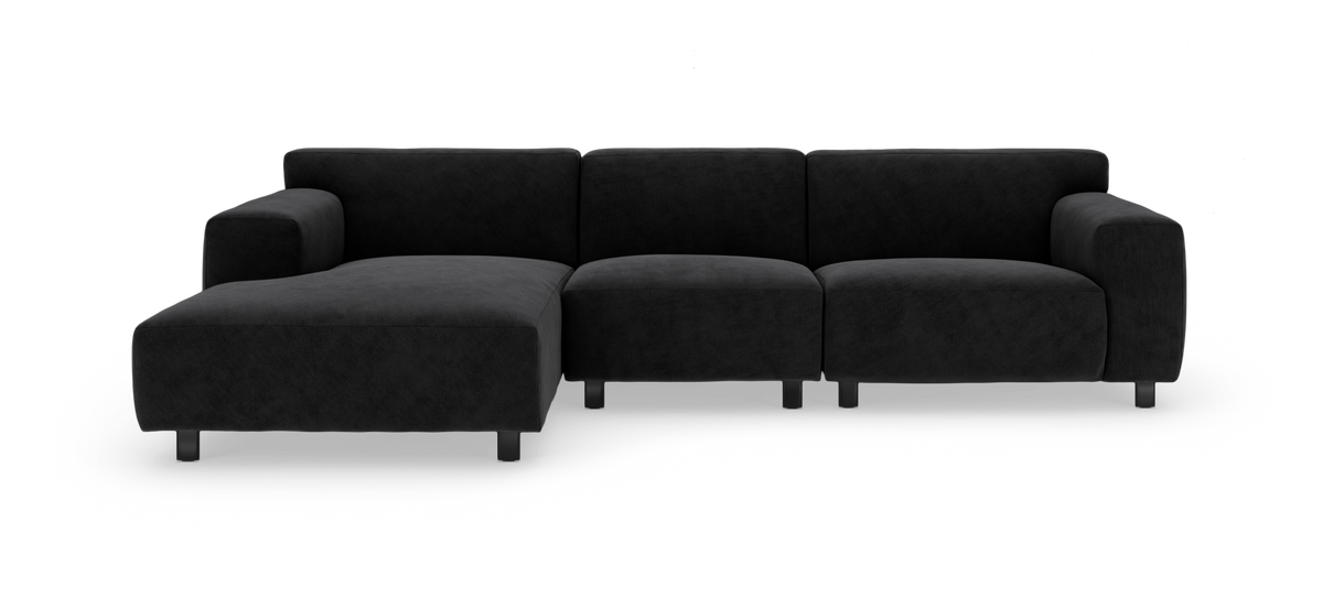 Svart modulsoffa med schäslong till vänster, frilagd på vit bakgrund.
