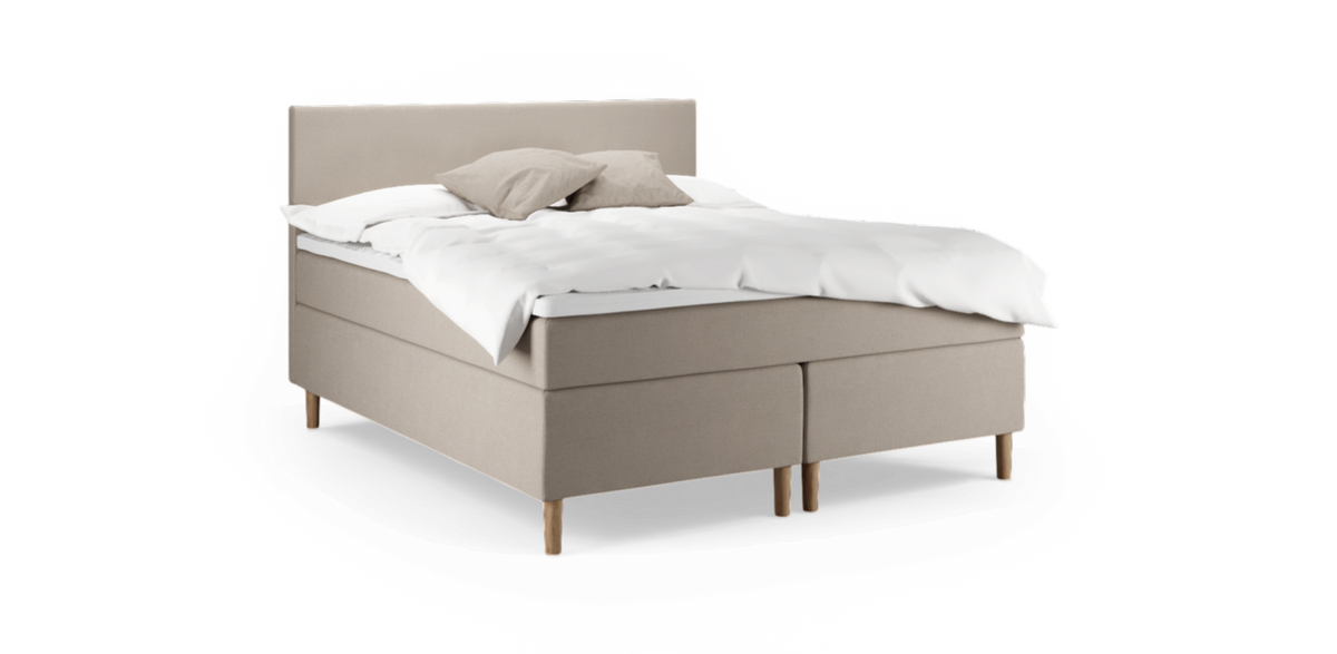 Beige kontinentalsäng med vit bäddning och två kuddar på träben.