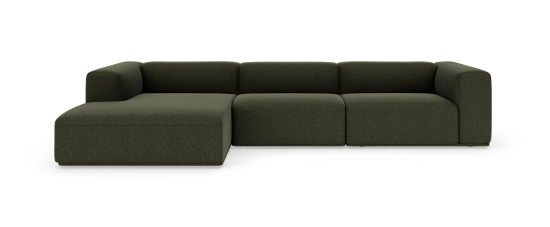 Mörkgrön modulsoffa med vänster divan, fyra sitsar, på vit studiobakgrund.