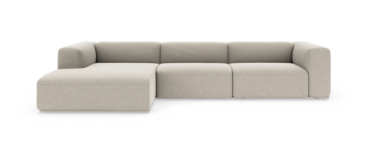 Beige modulsoffa med schäslong till vänster och rundade armstöd, frilagd studiobild.
