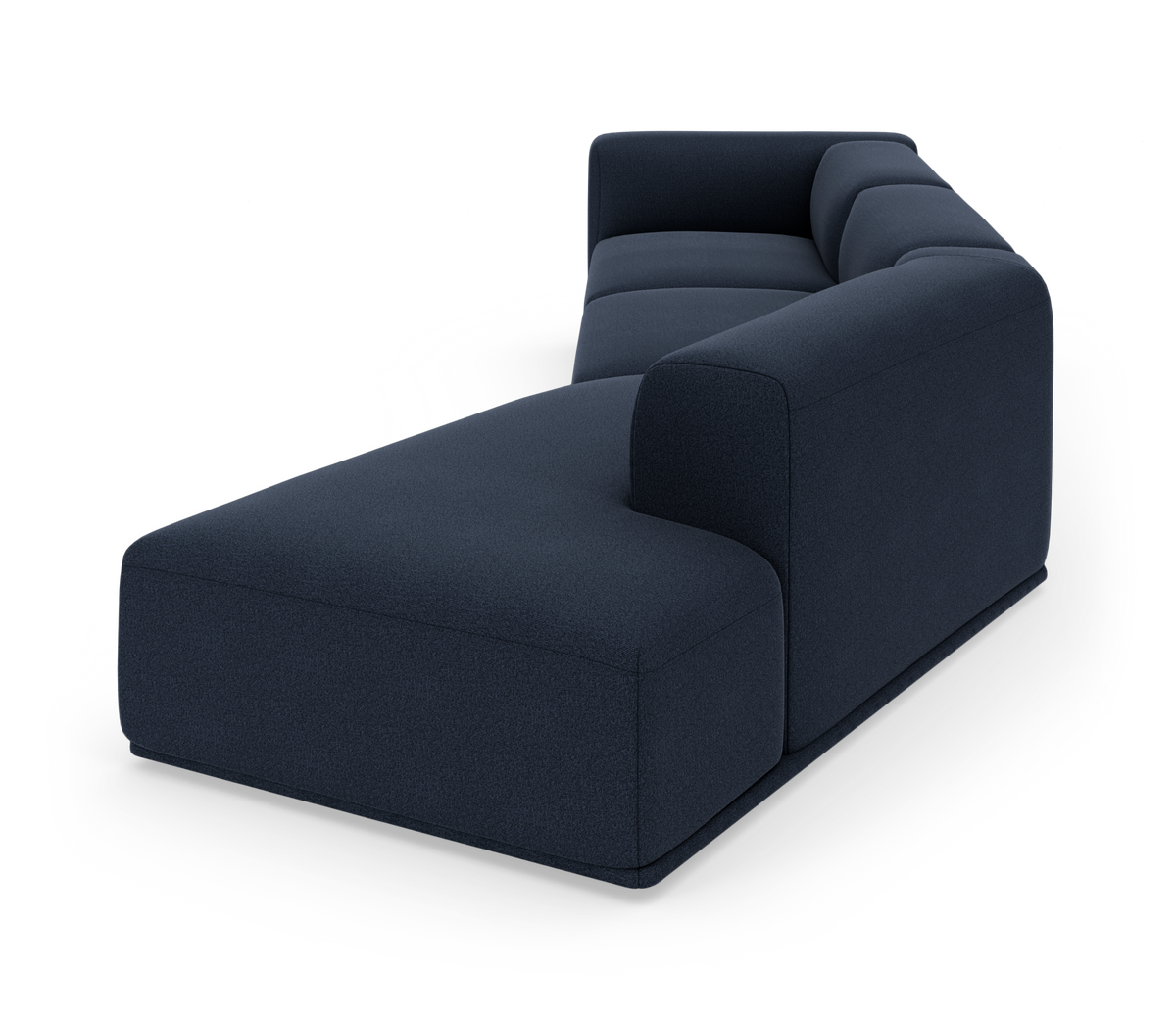 Mörkblå modulsoffa med chaiselong i modern, rundad design frilagd på vit bakgrund.