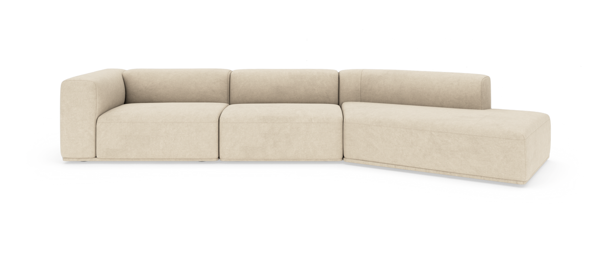 Beige modulsoffa med schäslong åt höger, fotad framifrån mot vit bakgrund.